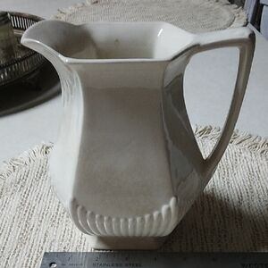 Elegant Cream Ceramic Art Piece with Fluted Design